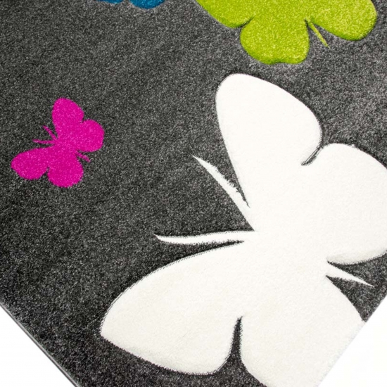 Niedlicher Schmetterlings-Teppich für Kinderzimmer in grau