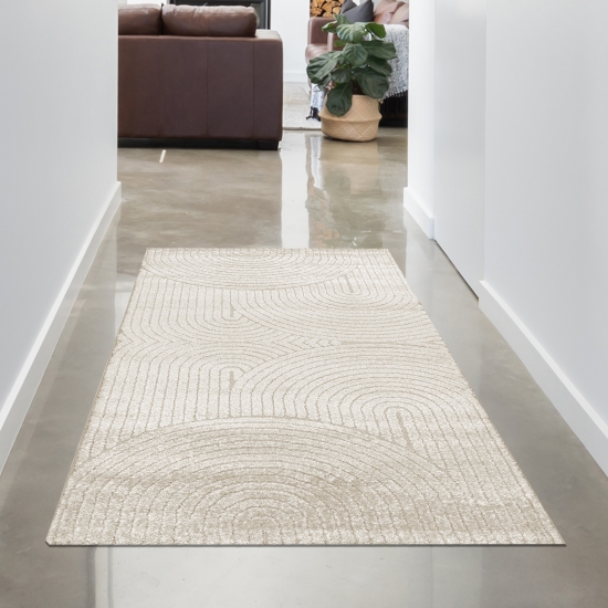 Moderner Teppich mit geschwungenem Muster in beige