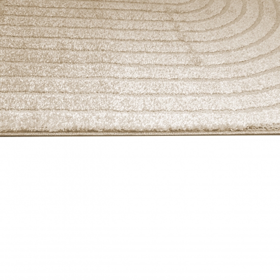 Moderner Teppich mit geschwungenem Muster in beige