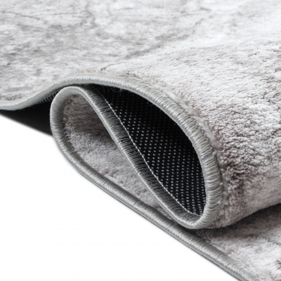 Eleganter marmorierter Kurzflor Teppich in stilvollem Grau