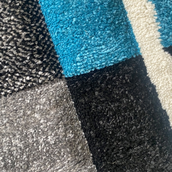 Designer Teppich Wohnzimmerteppich karo türkis grau creme schwarz