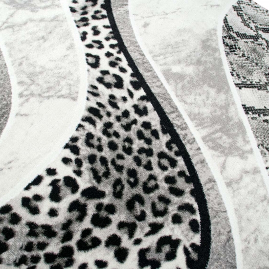 Preview: Designteppich Leopardenmuster Grau Schwarz Creme für moderne Räume