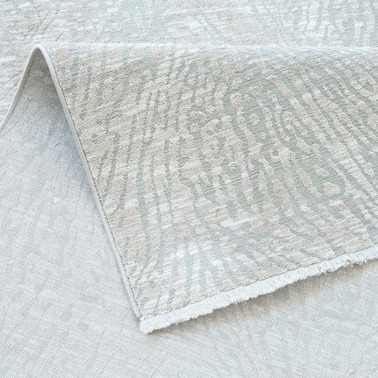 Moderner Teppich Creme mit organischem Linienmuster und Fransen