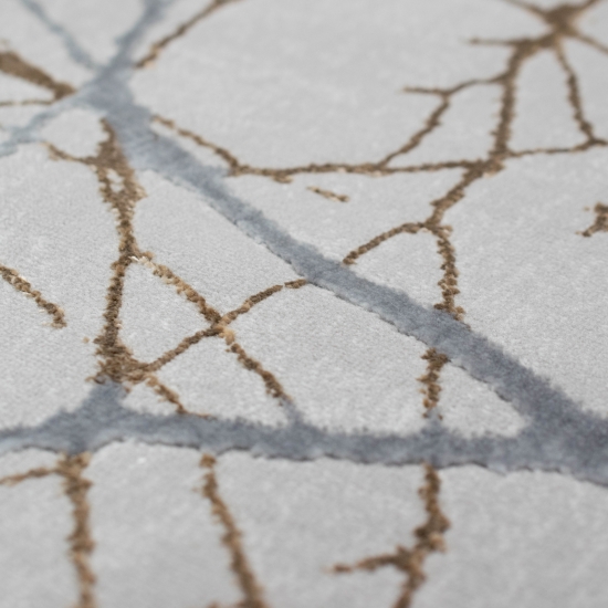 Moderner Designerteppich mit glänzenden Ästen abstrakt gold