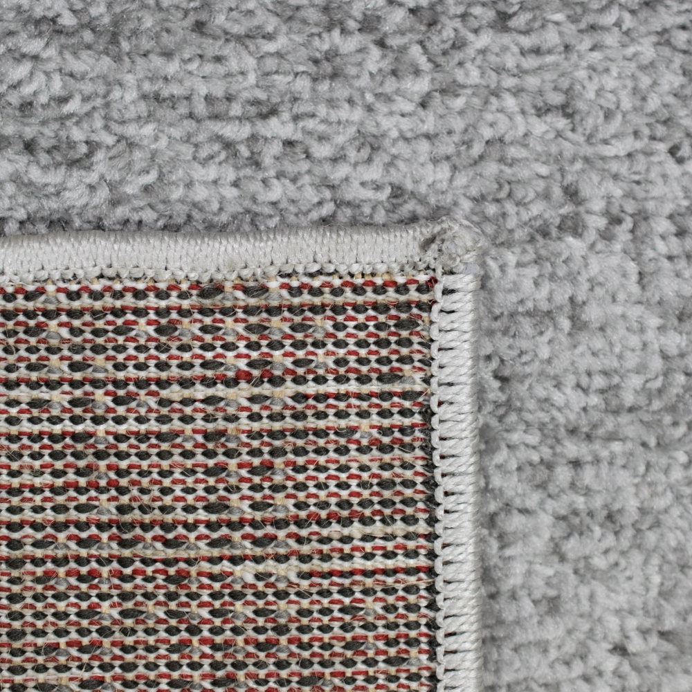Modern abstrakter Wellen-Karo Designerteppich in rot anthrazit
