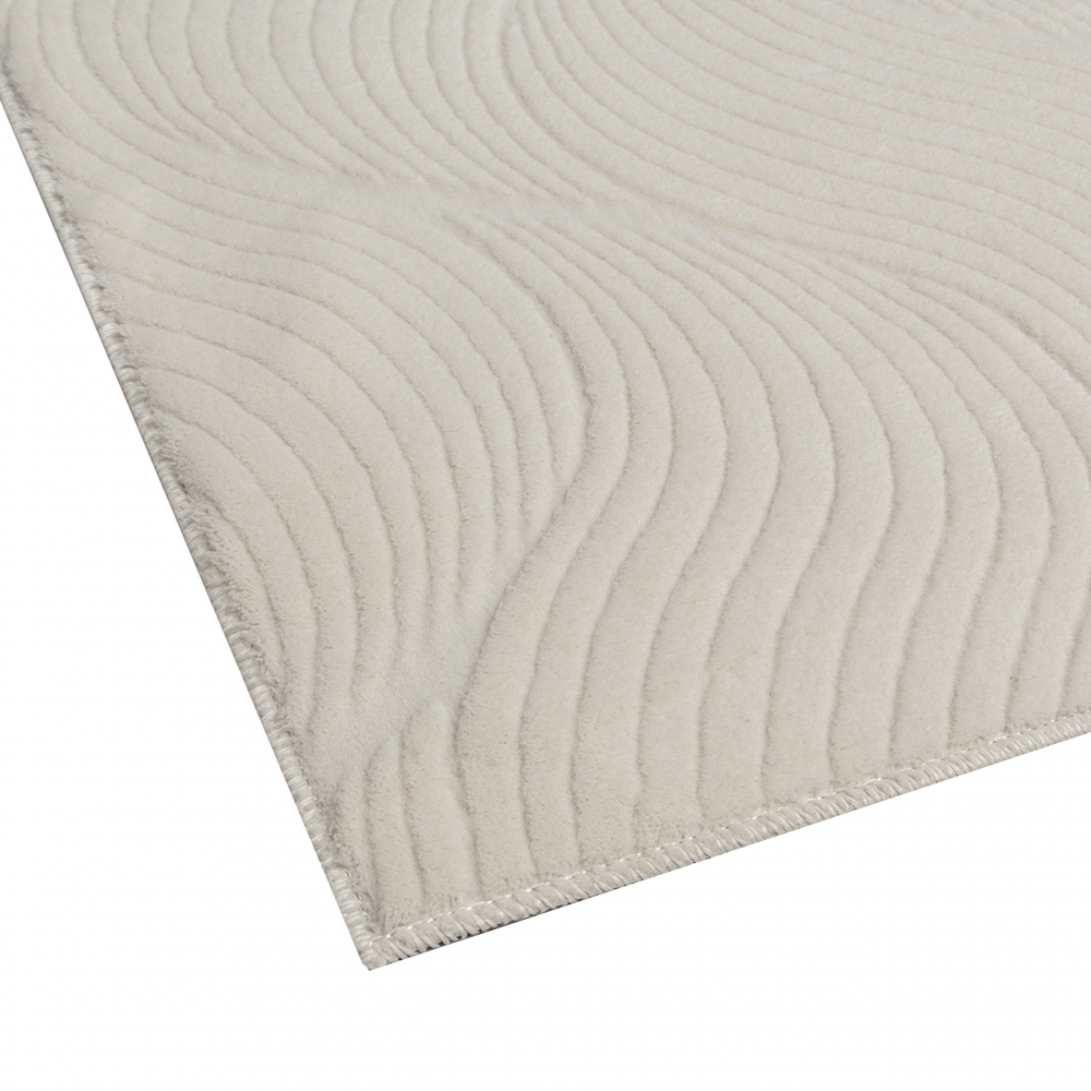 Schöner warmer Teppich mit elegantem Wellenmuster in creme