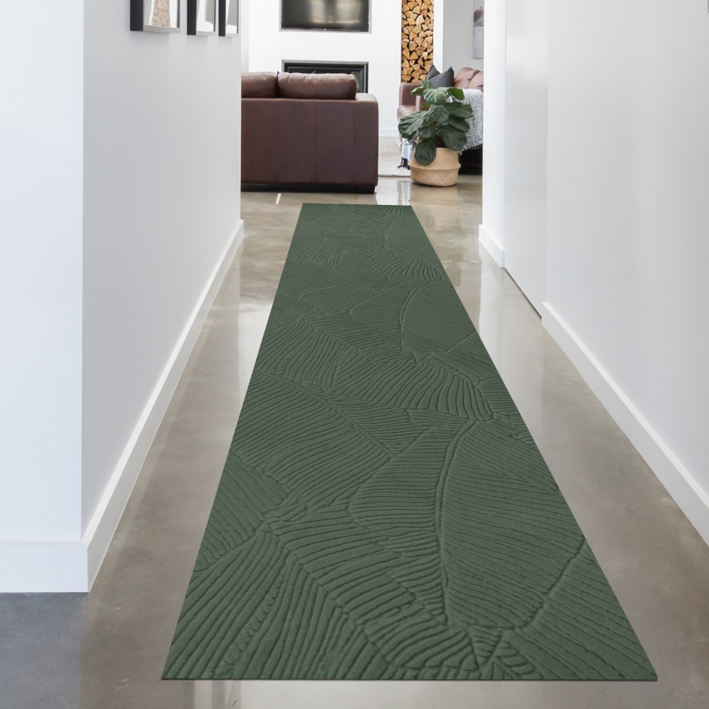 Schöner warmer Teppich mit elegantem Blättermuster in grün