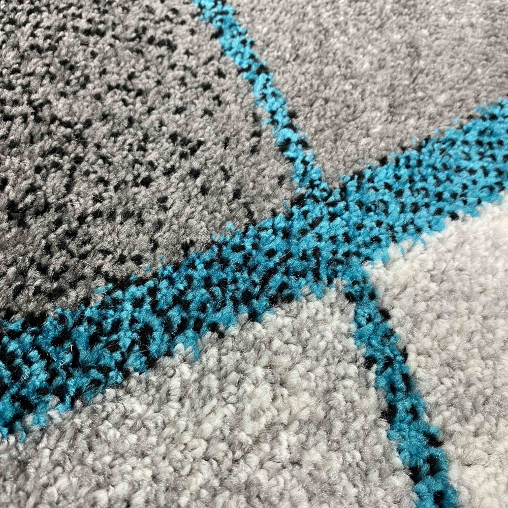 Teppich Wohnzimmer modernes Wellen Design in grau anthrazit blau - pflegeleicht