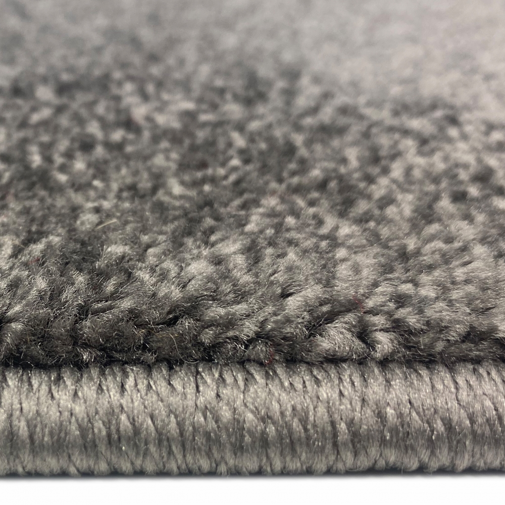 Stylischer Teppich mit Wellenoptik | in lila grau& weiß