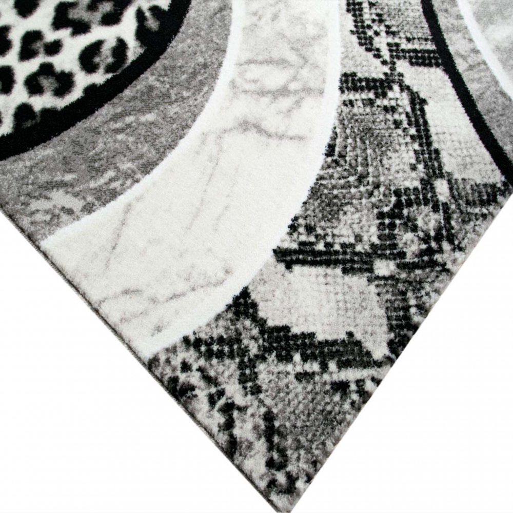Designteppich Leopardenmuster Grau Schwarz Creme für moderne Räume