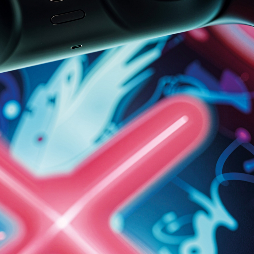 Auffälliger Gaming-Teppich mit lebendig-bunten neon-farbigen Symbolen und schwebendem Controller