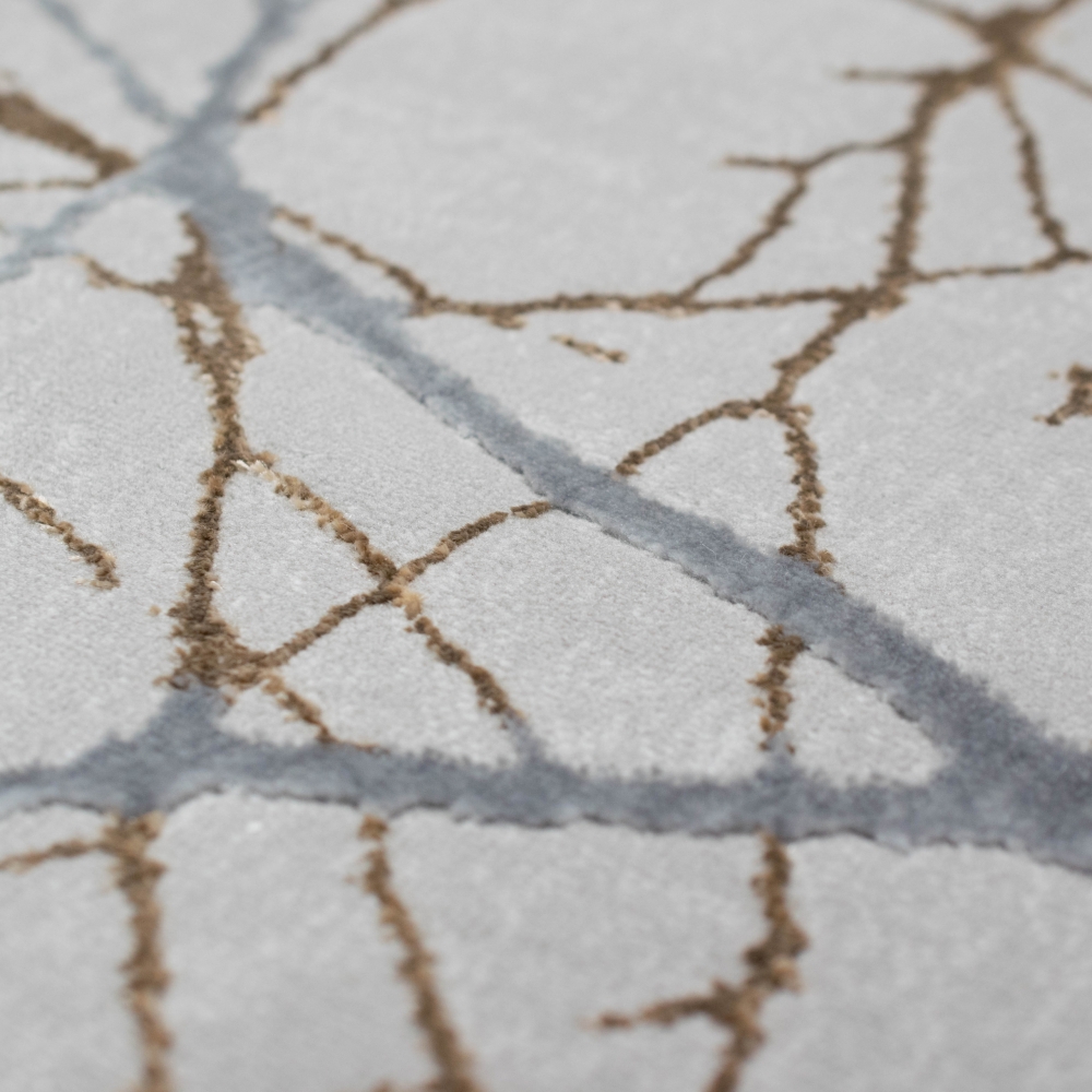 Moderner Designerteppich mit glänzenden Ästen abstrakt gold