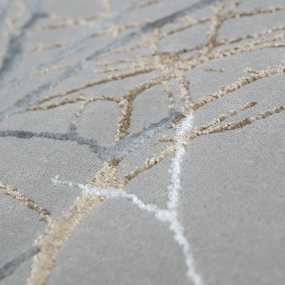 Moderner Designerteppich mit glänzenden Ästen abstrakt gold